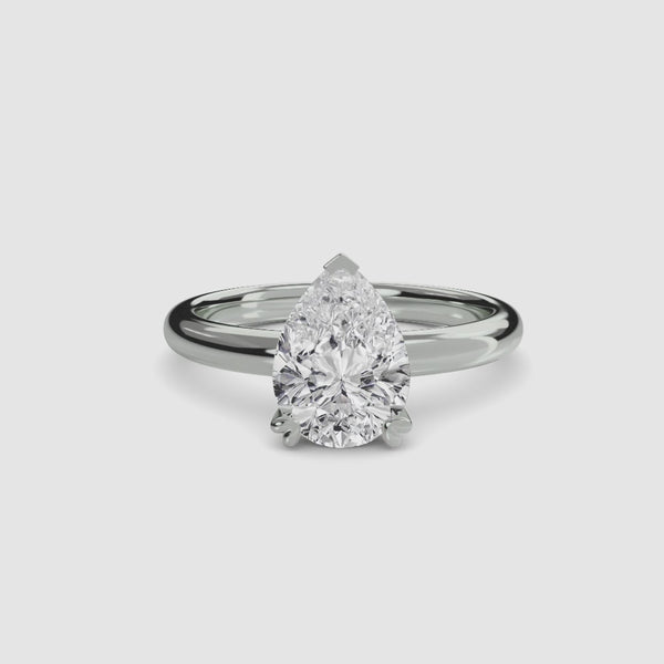360-degree rotation view the  Zevara pear shaped diamond double prong solitaire engagement ring in white gold