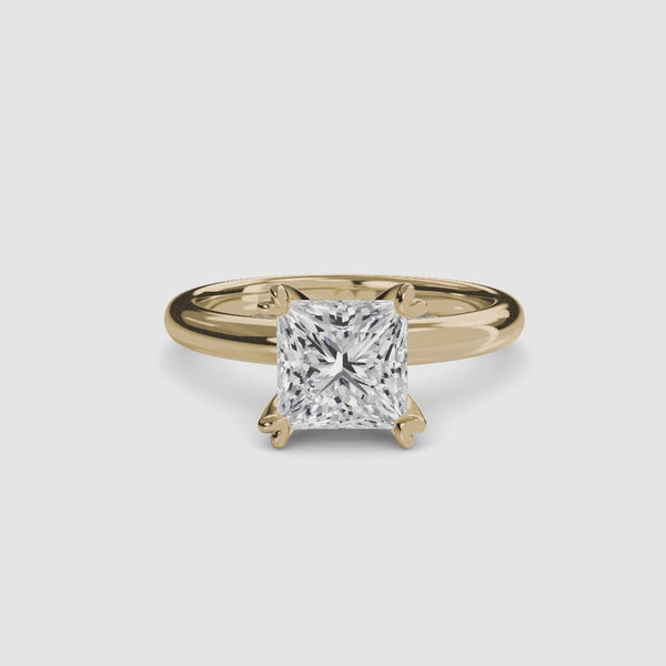 360-degree rotation view the Elowen princess cut diamond double prong solitaire engagement ring in yellow gold