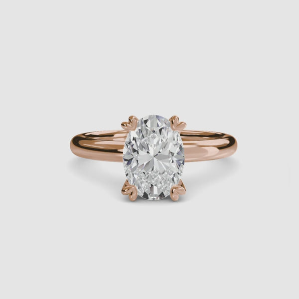360-degree rotation view the Alaria oval cut diamond double prong solitaire engagement ring in rose gold