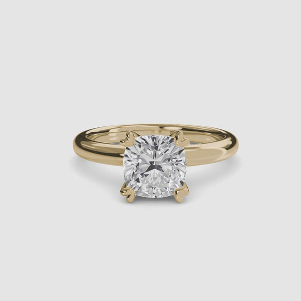 360-degree rotation view the Seris cushion cut diamond double prong solitaire engagement ring in yellow gold