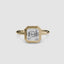 360-degree rotation view of The Lucen asscher cut diamond bezel engagement ring in yellow gold showing all angles