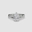 White gold ring with a pear-shaped diamond twisted pave shank on a white background.