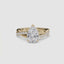 Gold ring with a pear-shaped diamond twisted pave shank on a white background.
