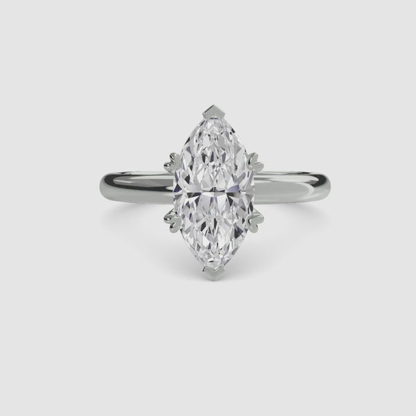 360-degree rotation view the Caelora marquise cut diamond double prong solitaire engagement ring in white gold