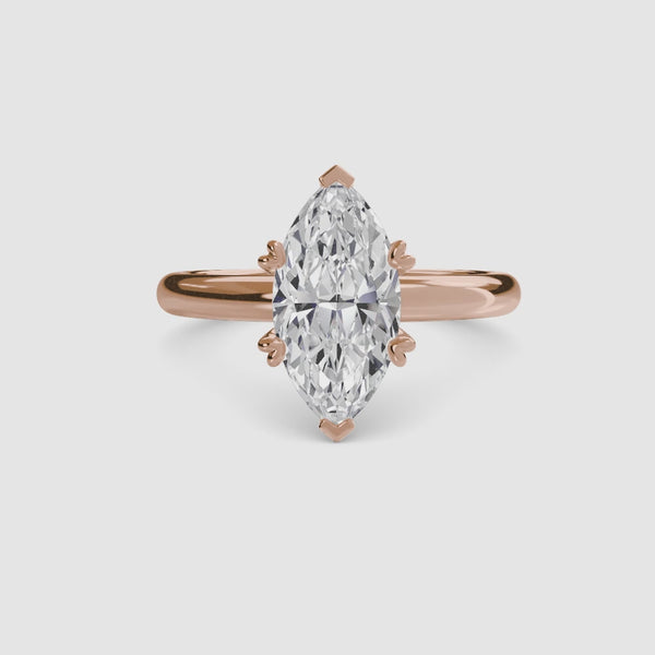 360-degree rotation view the Caelora marquise cut diamond double prong solitaire engagement ring in rose gold