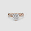Rose gold ring with a heart-shaped diamond twisted pave band on a white background