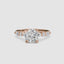 Rose gold ring with a large round diamond and smaller diamonds on the band against a white background