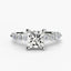 White gold ring with a large central princess diamond and smaller diamonds on the band against a white background