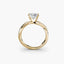 Gold ring with a diamond on a white background