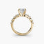 Gold princess diamond ring with a clear gemstone on a white background
