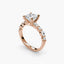 Rose gold ring with a diamond on a white background