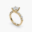 Gold ring with a princess diamond on a white background