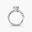 Diamond ring with a central princess-cut diamond and marquise round side stones on a white background