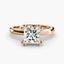 
Top-down view of a rose gold solitaire engagement ring featuring a large princess-cut diamond secured by eight ball-tipped prongs in a floral basket setting, with a plain polished tapered band