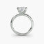 Front-facing view of a white gold solitaire engagement ring with a princess-cut diamond in an eight-prong tulip basket setting, showcasing the open gallery and plain rounded band against a light gray background.