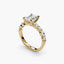 Gold ring with a central diamond and smaller stones on a white background