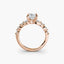Rose gold ring with a diamond on a white background