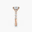 Rose gold ring with a diamond on a white background