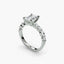 Diamond ring with a pear-shaped center stone on a white background