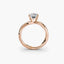 Rose gold ring with a diamond on a white background