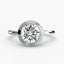 Round bezel diamond ring in solitaire white gold setting