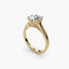 Gold solitaire ring with a round diamond brilliant cut on a white background