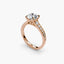 Rose gold ring with a round diamond on a white background