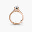 Rose gold ring with a diamond on a white background