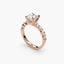 Rose gold ring with a diamond on a white background