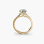 Gold ring with a diamond on a white background