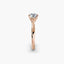 Profile view of The Solvane showing traditional four-prong rose gold solitaire setting with round diamond