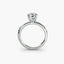 Side view of The Caelis showing double prong construction securing round diamond solitaire ring in white gold