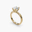 Round brilliant cut diamond solitaire engagement ring with double prong setting in yellow gold