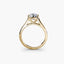 Gold ring with a diamond on a white background