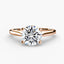 Rose gold solitaire ring with a round diamond brilliant cut on a white background