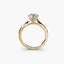 Side view of The Solvane showing traditional four-prong yellow gold solitaire setting with round diamond 
