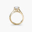 Solitaire gold ring with a center diamond