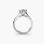 Solitaire diamond platinum ring on a white background