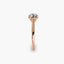 Rose gold ring with a diamond on a white background