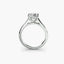 Platinum solitaire ring with a diamond on a white background