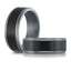 Close-up view of The Nullar showing brushed carbon fiber texture and tantalum beveled edges 8mm