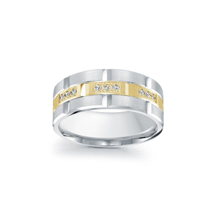Two-tone diamond ring with gold and silver bands on a white background